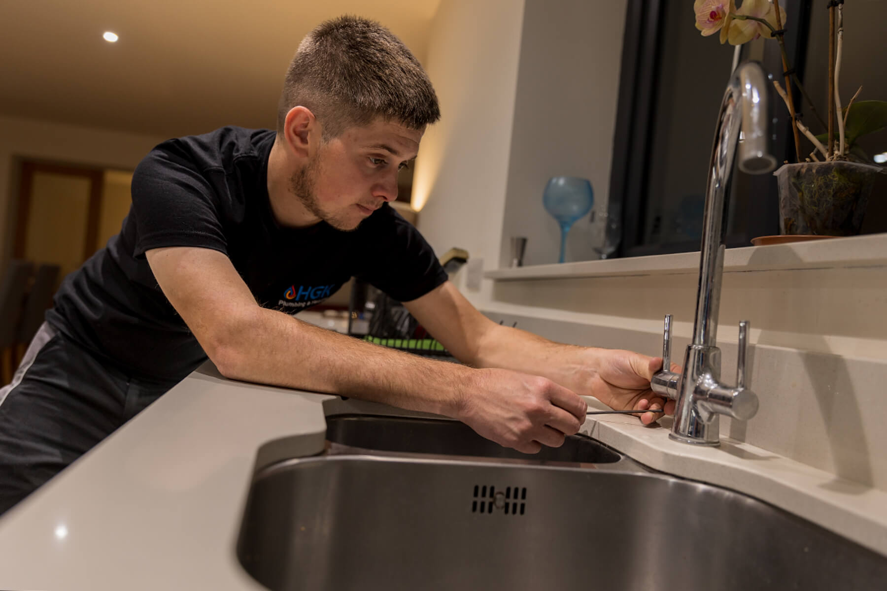 Harry Knowles - HGK Plumbing & Heating, Exeter, Devon fixing kitchen tap